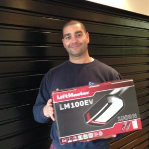 Competition winner holding a LiftMaster LM100EV